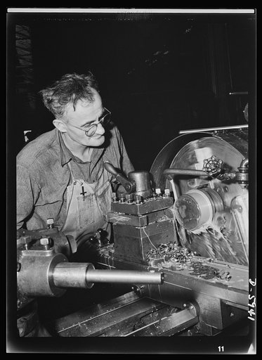 Manpower. Americans all. The country of this war worker's birth cringes under the brutal heel of the Nazis. Charles Kaper, born in Czechoslovakia, processes parts for medium tanks in an Illinois factory not far from the newly-founded Lidice, named for the Czech town which was savagely razed by the N