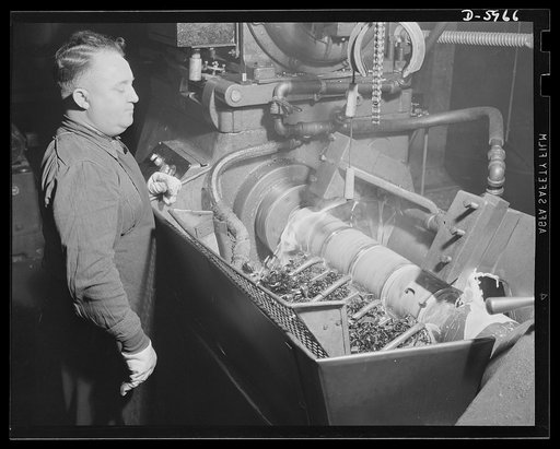 Production. 155mm shells. The first rough turn on a 155mm shell forging is done on a Curtis lathe in a converted auto plant. In this operation, the forging is cut to length and the base end is faced. Willy's, Toledo, Ohio