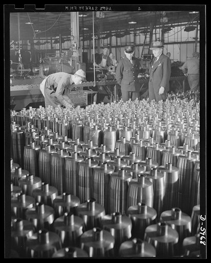 Production. 155mm shells. Careful inspection precedes the operations which form the noses of 155mm shells in a converted auto plant. Willy's, Toledo, Ohio