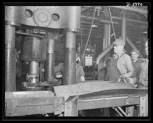 Production. 155mm shells. Noses are formed on 155mm shells in the Watson Stillman hydraulic press of a converted auto plant. Willy's, Toledo, Ohio