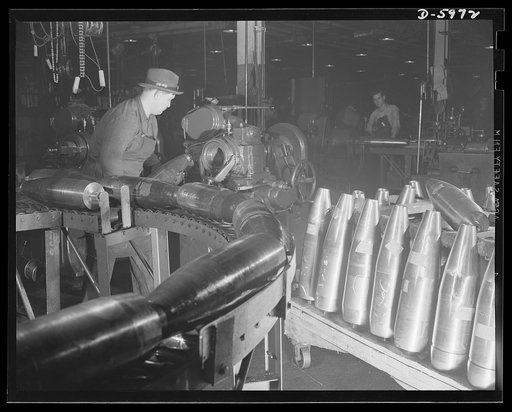 Production. 155mm shells. Threading the nose ends of 155mm shells in a Less-Bradner thread mill at a converted auto plant. Willy's, Toledo, Ohio