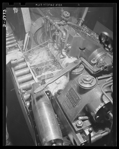 Production. 155mm shells. Finish turning of the straight diameter and profile of a 155mm shell on a Stamets lathe in a converted auto plant. Willy's, Toledo, Ohio