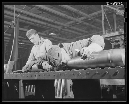 Production. 155mm shells. Inspecting 155mm shells, on which all machining operations have been completed, before painting in a converted auto plant. Willy's, Toledo, Ohio