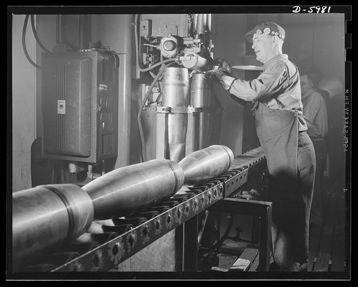 Production. 155mm shells. Welding base cover plates of 155mm shells on a Thomson-Gibb welder in a converted auto plant. Willy's, Toledo, Ohio