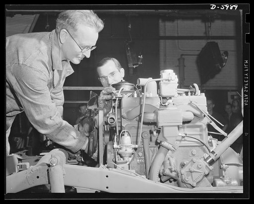 Production. Jeeps. Another hard-boiled recruit nearly ready for army service. A jeep motor is tuned up in a big Midwest auto plant. Willy's, Toledo, Ohio