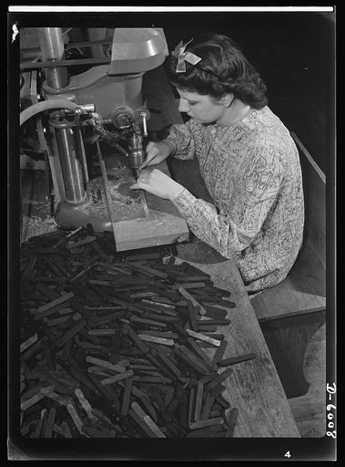Conversion. Pianos to airplane motors. Prior to the conversion of a Chicago piano factory to the manufacture of parts for trainer planes, Lorraine Avezzano operated this boring machine to prepare piano keyboards for further assembly. Today she uses the same machine to process connecting rods for tra