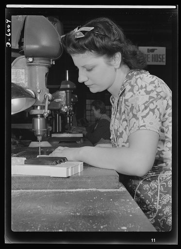 Conversion. Pianos to airplane motors. From piano keys to parts for trainer planes. Lorraine Avezzano, pictured at work in a Chicago piano factory prior to its conversion to war production. She uses the same boring machine today to process parts for Uncle Sam's trainer planes. Gulbransen Company