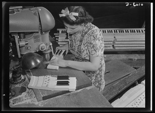 Conversion. Pianos to airplane motors. From piano keys to parts for trainer planes. Lorraine Avezzano, pictured at work in a Chicago piano factory prior to its conversion to war production. She uses the same boring machine today to process parts for Uncle Sam's trainer planes. Gulbransen Company