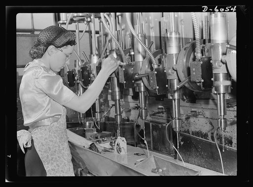 Women in war. Machine gun production operators. Operating a multiple drill press with speed and accuracy, this young woman is taking an active and important part in the war effort. She's machining gun parts in a Midwest plant which has shifted from production of spark plugs to the manufacture of mac