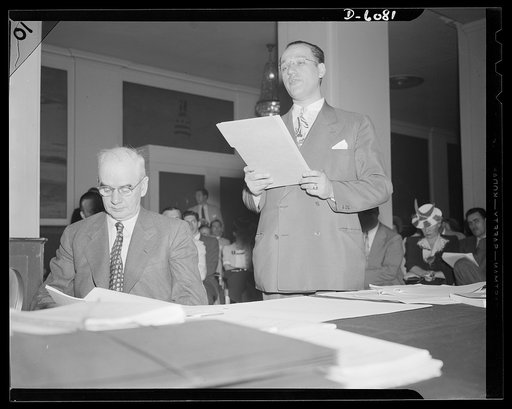 War Labor Board: "Little Steel" hearing. Philip Murray, Congress of Industrial Organization (CIO) leader, left, and Harold Ruttenberg, research director for United Steel Workers (USW), at the "Little Steel" hearing held by the War Labor Board, at the Hotel Washington in Washington, D.C., July 1. The