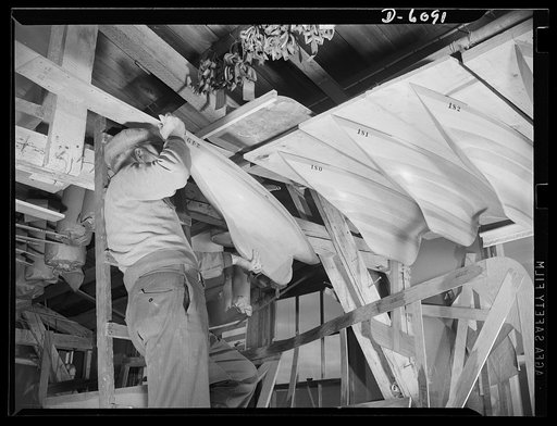 Production. Submarine chasers. Pleasure craft give way to Navy construction. Scale model of the last sailboat built at an Eastern yard now making subchasers and other Navy boats is stored away as the company goes all out for war production. Marine Construction Company, Stamford, Connecticut