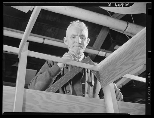 Production. Submarine chasers. Worker in the mold loft of an Eastern boatyard now engaged exclusively in the building of subchasers and other boats for the Navy. Marine Construction Company, Stamford, Connecticut
