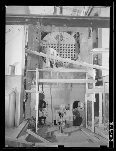 Conversion. Fuel oil to coal heating system. Guests can keep warm and tanks can crash German lines at the same time as a result of this Washington hotel's conversion from a fuel oil to a coal heating system. The man installing the coal plant appears dwarfed by the tremendous size of the furnace