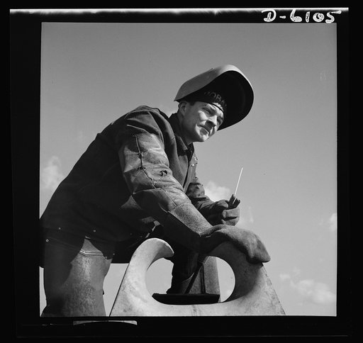 Production. Submarine chasers. An answer to the U-boats: more subchasers. A husky arc welder has just finished a job on one of the chocks of a chaser at an Eastern boatyard. Marine Construction Company, Stamford, Connecticut