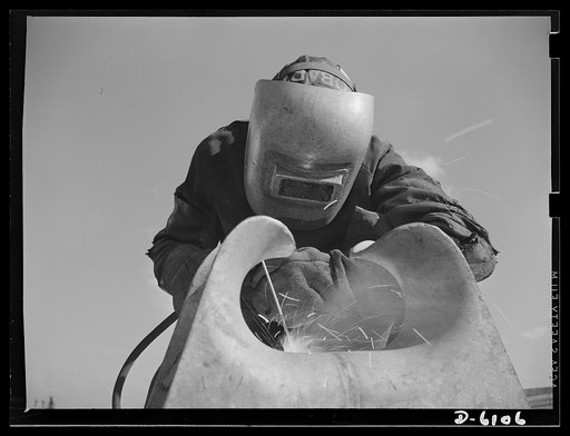 Production. Submarine chasers. An answer to the U-boats: more subchasers. A husky arc welder has just finished a job on one of the chocks of a chaser at an Eastern boatyard. Marine Construction Company, Stamford, Connecticut