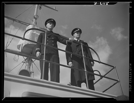 Production. Submarine chasers. Nemesis of the U-boat. A Navy skipper and executive officer stand on the bridge of their new command, a nearly completed 110-foot wooden subchaser that will soon leave an Eastern boatyard. Marine Construction Company, Stamford, Connecticut