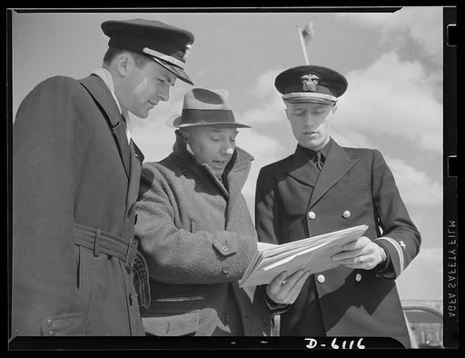 Production. Submarine chasers. Ready to harry the U-boat. The skipper and executive officer assigned to a subchaser nearing completion at an Eastern boatyard discuss the specifications of their new command with the government inspector who approved the job. Marine Construction Company, Stamford, Con
