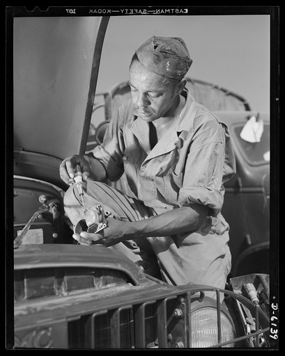 Fort Knox. Negro mechanics. He plays an important part in keeping army tansport fleets rolling. This Negro soldier, who serves as truck driver and mechanic, handles many repair and adjustment jobs at Fort Knox, Kentucky