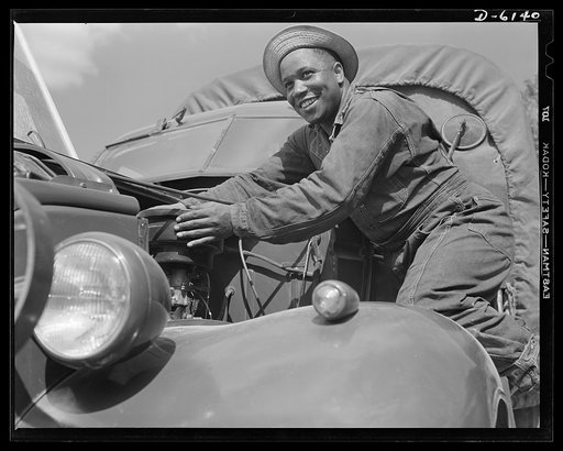 Fort Knox. Negro mechanics. A good job on the air cleaner of an army truck at Fort Knox, Kentucky. This Negro soldier, who serves as truck driver and mechanic, plays an important part in keeping army transport fleets in operation