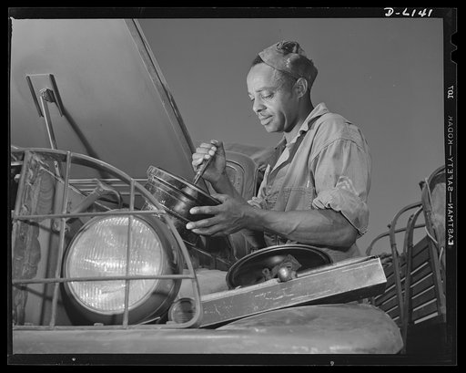 Fort Knox. Negro mechanics. A good job on the air cleaner of an army truck at Fort Knox, Kentucky. This Negro soldier, who serves as truck driver and mechanic, plays an important part in keeping army transport fleets in operation