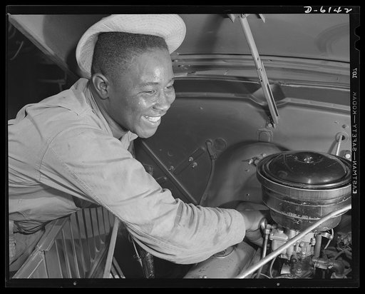 Fort Knox. Negro mechanics. Even army trucks need occasional carburetor adjustment. This Negro soldier, who serves as truck driver and mechanic at Fort Knox, Kentucky, plays an important part in keeping army transport fleets in operation