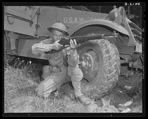 Fort Knox. Garand rifle. A young soldier of the armored forces, in training at Fort Knox, Kentucky, holds and sights his Garand rifle like an old timer. He likes the piece for its fine firing qualities and its rugged, dependable mechanism