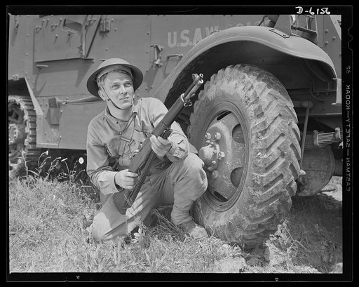 Fort Knox. Garand rifle. A young soldier of the armored forces, in training at Fort Knox, Kentucky, holds and sights his Garand rifle like an old timer. He likes the piece for its fine firing qualities and its rugged, dependable mechanism