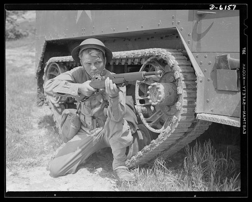 Fort Knox. Garand rifle. A young soldier of the armored forces, in training at Fort Knox, Kentucky, holds and sights his Garand rifle like an old timer. He likes the piece for its fine firing qualities and its rugged, dependable mechanism