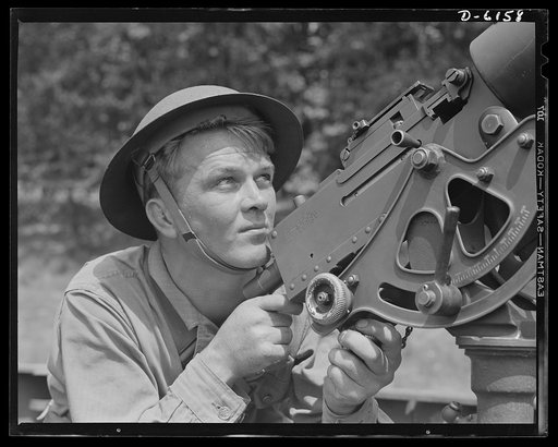 Fort Knox. Browning machine gun. Good man, good gun. A private of the armored forces, in training at Fort Knox, Kentucky, does some practice shooting with a 30-caliber Browning machine gun. The gun is mounted on a pedestal for anti-aircraft work
