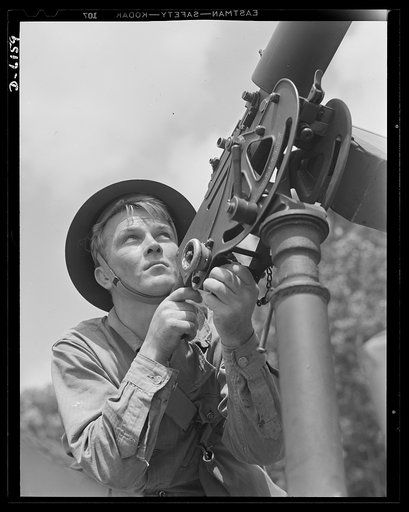Fort Knox. Browning machine gun. Good man, good gun. A private of the armored forces, in training at Fort Knox, Kentucky, does some practice shooting with a 30-caliber Browning machine gun. The gun is mounted on a pedestal for anti-aircraft work