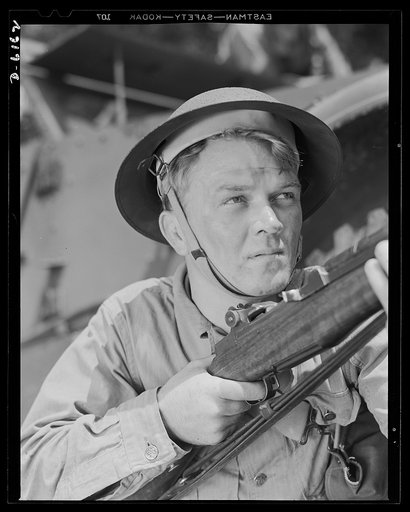 Fort Knox. Garand rifle. A young soldier of the armored forces, in training at Fort Knox, Kentucky, holds and sights his Garand rifle like an old timer. He likes the piece for its fine firing qualities and its rugged, dependable mechanism