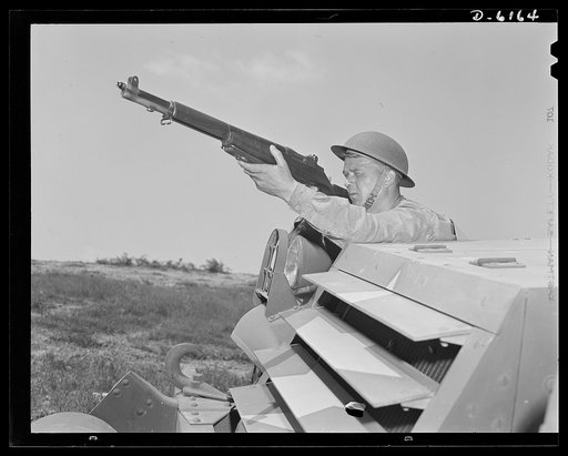 Fort Knox. Garand rifle. A young soldier of the armored forces, in training at Fort Knox, Kentucky, holds and sights his Garand rifle like an old timer. He likes the piece for its fine firing qualities and its rugged, dependable mechanism
