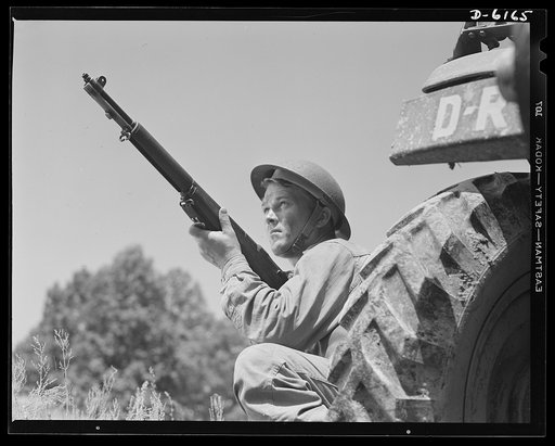 Fort Knox. Garand rifle. A young soldier of the armored forces, in training at Fort Knox, Kentucky, holds and sights his Garand rifle like an old timer. He likes the piece for its fine firing qualities and its rugged, dependable mechanism