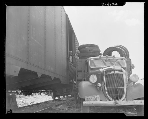 Salvage. Scrap tires. On their way to swell America's most important  stockpile. Employees of a large Southern junkyard load scrap tires for shipment to a reclaiming plant where the rubber will be removed and processed into essential war materials