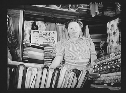 Posting ceiling prices in foreign languages. America's shopper must be able to see and understand ceiling prices, so Freda Altberg's small yard goods shop in one of New York's East Side marketplaces has maximum prices for its stock posted in Yiddish. The sign reads, "Price Ceilings on Yard Goods," a