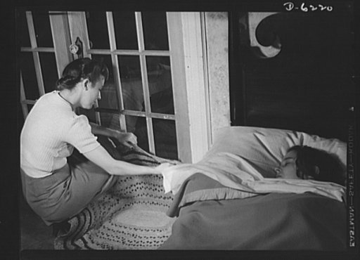 Fuel oil conservation. This family likes to sleep with the bedroom windows open. The housewife prevents drafts from entering by laying a rug against the door so the cold air will not chill the rest of the house