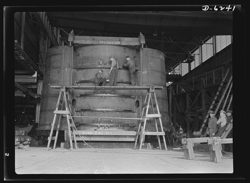 Production. Submarines. Construction of the hull section of a submarine at Manitowoc, Wisconsin. These sections will be assembled in a small bay, and when completely installed will be sent through the Saint Lawrence Canal to the sea