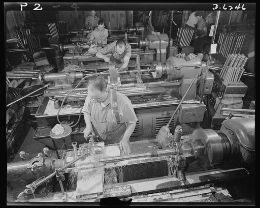 Production. Machine guns of various calibers. High-speed lathe operators in the plant of a large manufacturer of firearms perform precision operations on the barrels of machine guns. The plant also employs many women in turning out vital weapons for the armed forces