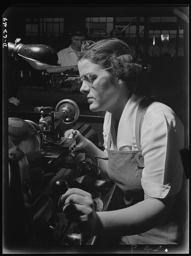 Production. Machine guns of various calibers. Agnes Mahan, bench lathe operator at a large Eastern firearms plant, makes oil drills for .50- caliber machine gun barrels. Many women workers are employed in this plant, producing essential weapons for the armed forces