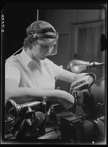 Production. Machine guns of various calibers. Dorothy Taylor, bench lathe operator at a large Eastern firearms plant, makes oil drills for .50- caliber machine gun barrels. Many women workers are employed in this plant, producing essential weapons for the armed forces