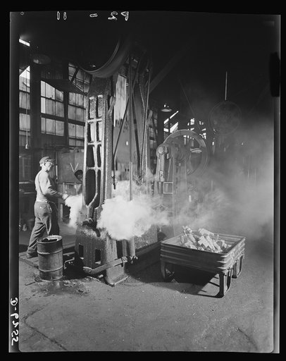 Production. Machine guns of various calibers. In the drop forge shop of a large firearms plant, a skilled operator shapes a forging for the trunnion block of a .50-caliber machine gun. Many women are now employed in this plant producing essential weapons for the armed forces