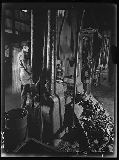 Production. 45-caliber pistols. Norman Rand forges frames for .45- caliber automatic pistols in the plant of a large manufacturer of firearms. Many men and women are employed here in turning out pistols, machine guns and other essential weapons for the armed forces