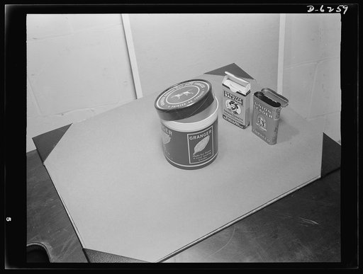 Substitute materials containers. Wartime tobacco containers. Left to right: one-pound fiber container, two-ounce fiber container, and two-ounce metal can. Fiber is expected to be used for tobacco containers for the duration