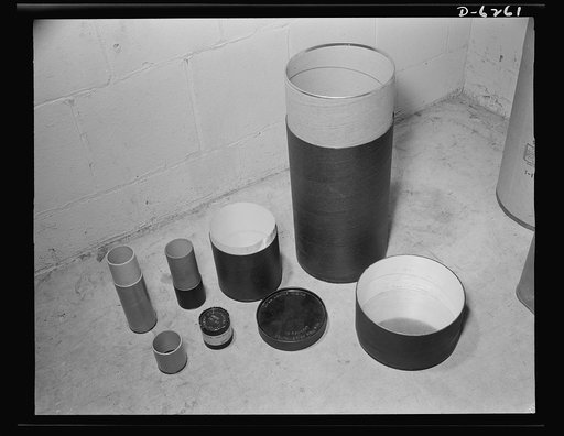 Substitute materials containers. These new types of fiber shell containers with metal rims on the ends are being experimented with for shell, howitzers and hand grenades