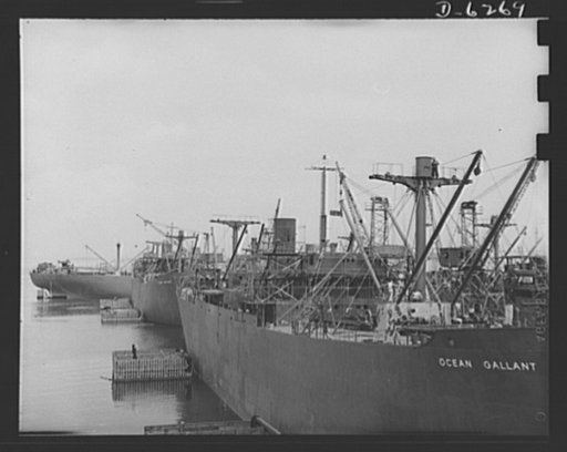 Ship launching in Portland, Maine. Some of the five British cargo-carrying ships built under lend-lease at a large New England yard and launched along with two destroyers and one liberty ship at a record breaking mass launching August 16, 1942