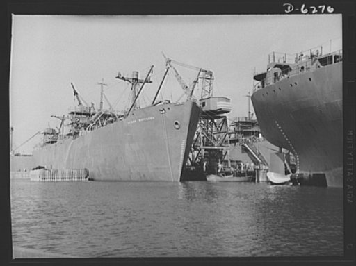 Ship launching in Portland, Maine. Some of the five British cargo-carrying ships built under lend-lease at a large New England yard and launched along with two destroyers and one liberty ship at a record breaking mass launching August 16, 1942