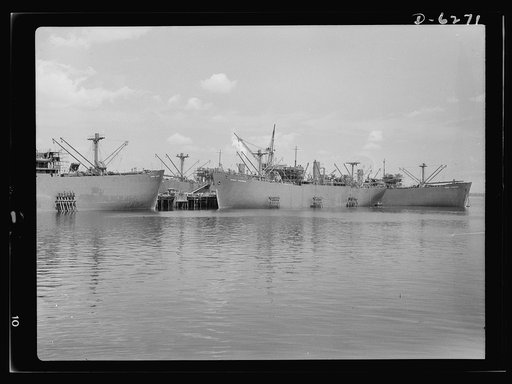 Ship launching in Portland, Maine. Some of the five British cargo-carrying ships built under lend-lease at a large New England yard and launched along with two destroyers and one liberty ship at a record breaking mass launching August 16, 1942