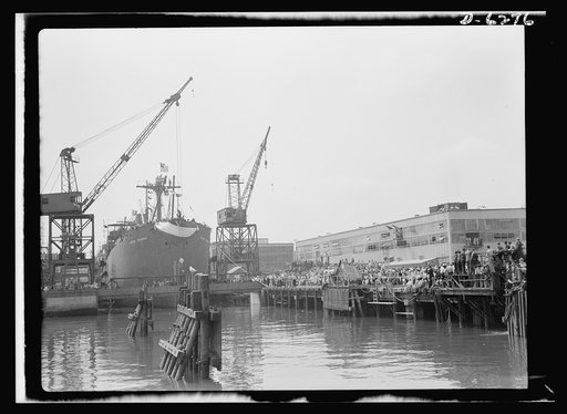 Ship launching in Portland, Maine. Spectators crowded the docks when Ocean Seaman, one of five lend-lease cargo-carrying ships built for Britain, was christened at a Maine shipyard on August 16, 1942. The vessel was completed forty-eight days after its keel was laid