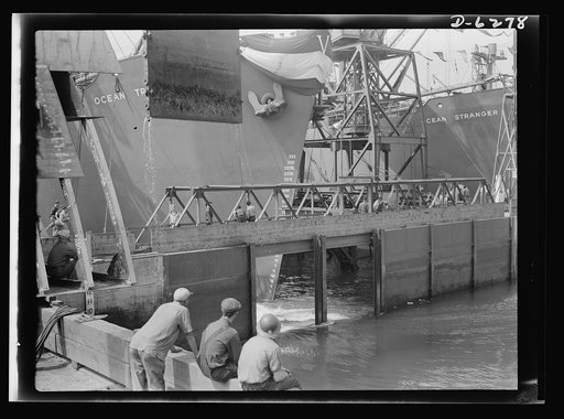Ship launching in Portland, Maine. A second gate is opened, water floods the basin and another ship takes the water at a New England shipyard at a mass launching on August 16, 1942, in which eight vessels went into service