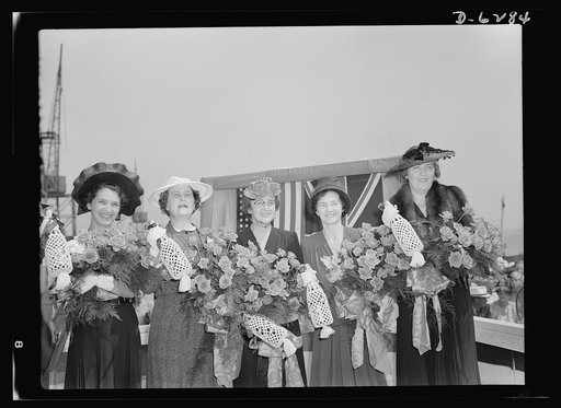 Ship launching in Portland, Maine. Eight vessels slid into the water in a record breaking launching August 16, 1942, at a large New England shipyard. Christening five cargo-carrying ships built for Britain at the mass launching were, left to right: Mrs. Peter V.O. Evans, wife of a director of the Br